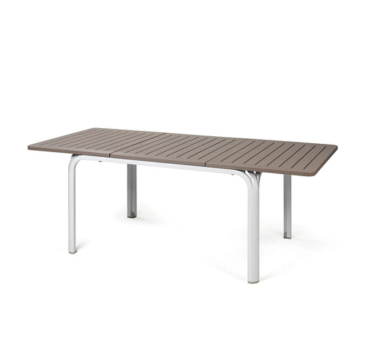Mesa extensible ALLORO de Nardi con tablero color topo y patas blancas de aluminio.